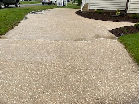 Clean driveway surface maintained by Cypress Property Maintenance